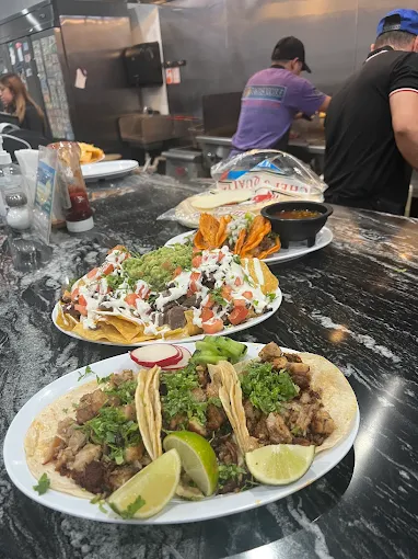 Tacos, loaded nachos, and birria plates at Tacos Nicole